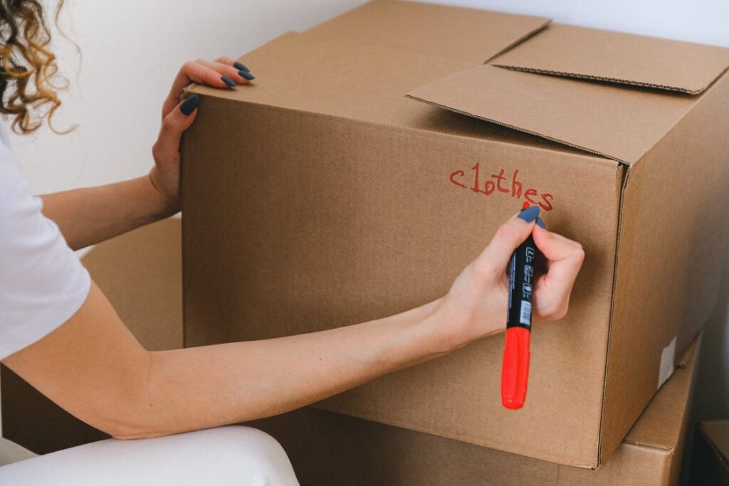 woman labeling boxes